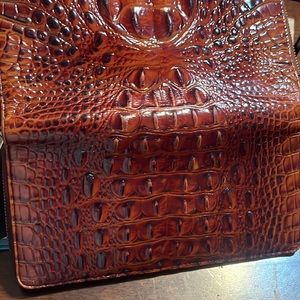 Very pretty large sized wallet. Tons of card space, phone and bill section.